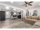 Open-concept living space with a modern kitchen and a comfortable living area with neutral tones at 1919 W Fairmount Ave, Phoenix, AZ 85015