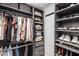 Organized walk-in closet featuring custom shelving and hanging racks for optimal storage at 1919 W Fairmount Ave, Phoenix, AZ 85015