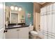 Bright bathroom features granite countertop vanity and shower with a decorative curtain at 20473 N Desert Sage Ln, Surprise, AZ 85374