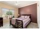 Serene bedroom with natural light, a large window, and a calming color scheme, offering relaxation at 20473 N Desert Sage Ln, Surprise, AZ 85374