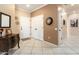 Inviting foyer featuring tiled flooring, neutral paint, and decorative accents at 20473 N Desert Sage Ln, Surprise, AZ 85374