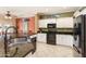 Bright kitchen with granite countertops, white cabinets, and stainless steel appliances at 20473 N Desert Sage Ln, Surprise, AZ 85374