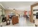 Spacious living room with tile flooring, ceiling fans, and access to dining and kitchen areas at 20473 N Desert Sage Ln, Surprise, AZ 85374