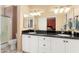 Spacious main bathroom boasts dual sinks, ample counter space and a separate glass shower at 20473 N Desert Sage Ln, Surprise, AZ 85374