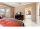 Comfortable bedroom with lots of natural light, neutral colors and ensuite bathroom access at 20473 N Desert Sage Ln, Surprise, AZ 85374