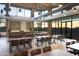 Bright common area with tables, chairs, and windows offering scenic views, perfect for gatherings and events at 22026 N 28Th Pl, Phoenix, AZ 85050