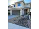 Beautiful two-story home with a modern garage door, desert landscaping, and neutral color palette at 22026 N 28Th Pl, Phoenix, AZ 85050