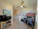 Hallway features a workstation, tv with stand, and a neutral color scheme for a comfortable atmosphere at 22026 N 28Th Pl, Phoenix, AZ 85050