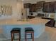 Open-concept kitchen with a large island, granite countertops, stainless steel appliances, and ample cabinet space at 22026 N 28Th Pl, Phoenix, AZ 85050