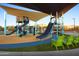 Community playground with slides, climbing structures, and shade canopies, offering a fun space for  at 22026 N 28Th Pl, Phoenix, AZ 85050
