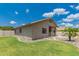 Expansive backyard features lush green grass, rock border, and view of swimming pool area at 2233 S Nielson St, Gilbert, AZ 85295