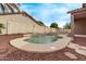 A fenced backyard featuring an in-ground pool surrounded by well-kept landscaping at 2233 S Nielson St, Gilbert, AZ 85295