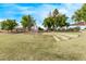 Community ball field with tiered seating and lush grass under a clear blue sky at 2233 S Nielson St, Gilbert, AZ 85295