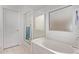Bright bathroom featuring a soaking tub with glass shower enclosure at 2233 S Nielson St, Gilbert, AZ 85295