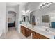 Spacious bathroom with double vanity, large mirror, and separate tub and shower at 2233 S Nielson St, Gilbert, AZ 85295
