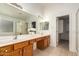 This bathroom boasts dual sinks, a large mirror, and ample cabinet space at 2233 S Nielson St, Gilbert, AZ 85295