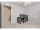This bedroom features neutral carpet, white walls, and ample space for a computer and chair at 2233 S Nielson St, Gilbert, AZ 85295