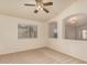 Cozy bedroom with neutral carpet, a ceiling fan, and abundant natural light creating a peaceful retreat at 2233 S Nielson St, Gilbert, AZ 85295