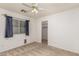 This bedroom features a ceiling fan and has a closet nearby at 2233 S Nielson St, Gilbert, AZ 85295