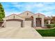 Charming home featuring a tile roof, three-car garage, and a well-manicured lawn at 2233 S Nielson St, Gilbert, AZ 85295