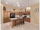Beautiful kitchen with custom wood cabinetry, stainless steel appliances, and center island at 2233 S Nielson St, Gilbert, AZ 85295