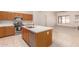 Functional kitchen island with integrated appliances and modern countertops, open to a bright living space at 2233 S Nielson St, Gilbert, AZ 85295