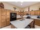 Charming kitchen features granite counters, modern appliances, and ample cabinet space at 2233 S Nielson St, Gilbert, AZ 85295