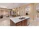 The kitchen features a large island with stainless steel sink and opens to the living area at 2233 S Nielson St, Gilbert, AZ 85295