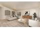 Inviting living room featuring neutral tones, plush carpeting, and stylish furniture for a comfortable ambiance at 2233 S Nielson St, Gilbert, AZ 85295