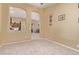 Bright living room with carpet, vaulted ceiling, natural light, and open view to kitchen at 2233 S Nielson St, Gilbert, AZ 85295