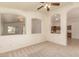 Open living room with elegant arches, neutral tones, and seamless transitions to adjacent spaces at 2233 S Nielson St, Gilbert, AZ 85295