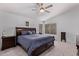 Comfortable bedroom suite featuring plush carpeting, a ceiling fan, and ample natural light at 2233 S Nielson St, Gilbert, AZ 85295