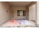 Outdoor patio space showcasing covered entry, dual entry doors, and decorative stones at 2233 S Nielson St, Gilbert, AZ 85295