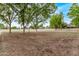 A community soccer field shows green trees surrounding a well-maintained natural grass field at 2233 S Nielson St, Gilbert, AZ 85295