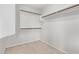 An empty walk-in closet with shelves and bars awaits your personal customization at 2233 S Nielson St, Gilbert, AZ 85295
