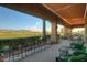 Inviting outdoor patio with comfortable seating, lush landscaping, and picturesque views at 22940 W Desert Bloom St, Buckeye, AZ 85326
