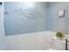 Powder bath with blue accents, wainscoting, and stylish decor at 2322 E Dolphin Ave, Mesa, AZ 85204