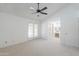 This bright bedroom boasts neutral carpet and adjoins the ensuite bathroom at 2322 E Dolphin Ave, Mesa, AZ 85204