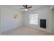 Bright carpeted bedroom with ceiling fan and window at 2322 E Dolphin Ave, Mesa, AZ 85204