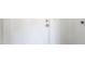 Clean white door with modern hardware, showcasing simplicity and functionality at 2322 E Dolphin Ave, Mesa, AZ 85204