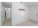 Bright entryway with neutral carpet and tile, light walls, and modern decor at 2322 E Dolphin Ave, Mesa, AZ 85204