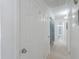 Hallway view featuring multiple rooms, including a bathroom with updated tiling at 2322 E Dolphin Ave, Mesa, AZ 85204