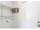Functional laundry room with shelving for storage and a utilitarian design at 2322 E Dolphin Ave, Mesa, AZ 85204