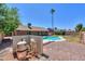 Backyard pool with surrounding patio near desert landscaping at 2322 E Dolphin Ave, Mesa, AZ 85204