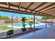 Inviting pool area with a covered patio, perfect for outdoor relaxation and entertainment at 2322 E Dolphin Ave, Mesa, AZ 85204
