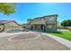 Expansive backyard featuring a private pool, lush lawn, and ample space for outdoor entertaining at 248 S 167Th Dr, Goodyear, AZ 85338