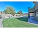 Spacious backyard with green lawn and an inviting pool area for leisure and entertainment at 248 S 167Th Dr, Goodyear, AZ 85338