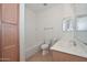 Bathroom view showing the bath tub, toilet, wooden cabinet and sink at 248 S 167Th Dr, Goodyear, AZ 85338