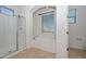 Well-lit bathroom features a glass shower, separate soaking tub, and large window at 248 S 167Th Dr, Goodyear, AZ 85338