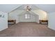 The bonus room includes plush carpet, two ceiling fans, and two built-in desks at 248 S 167Th Dr, Goodyear, AZ 85338